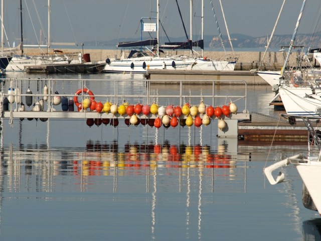 Colourful fenders. The anchor in the right hand corner of photograph is a Bruce or Claw anchor. 