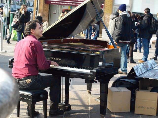 Near the Venice railway station there was this very serious busker. First time we have seen a busker on a grand piano. 
