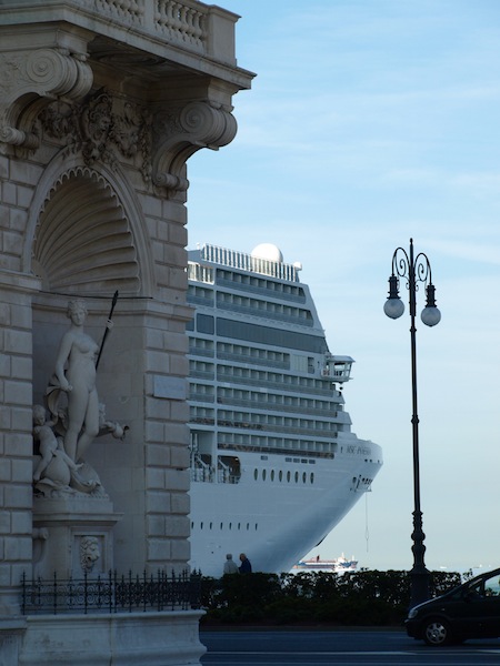 The corner stone of the Lloyd Triestino building and a huge cruise liner. The liner was flying a Blue Peter flag so it was getting ready to sail. 