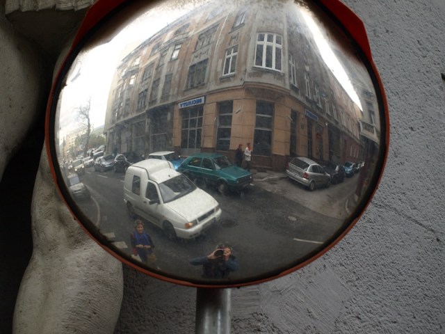 Wandering the streets of Sarajevo. Note the knee to the left of the mirror. 