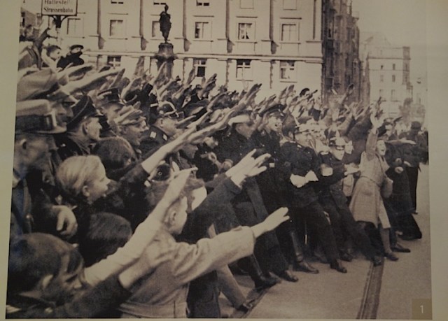 Enthusiastic followers giving the Nazi salute. 