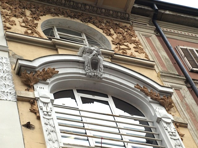 Incredible hood mould ornamentation. What holds me here is the expression on the keystone face and the terracotta sprigging. 