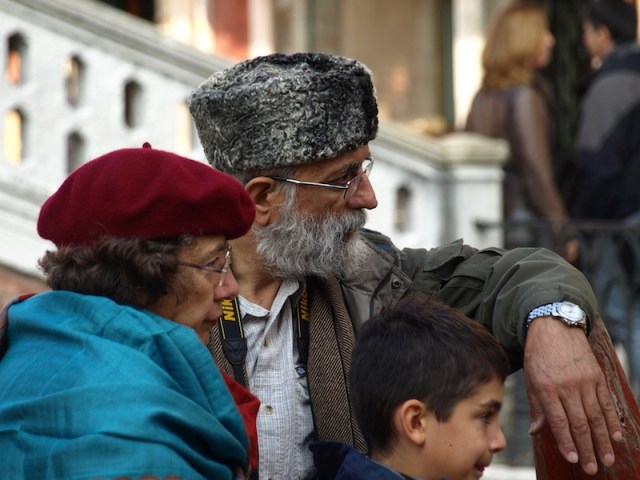 Tourists contemplating a gondola ride. 