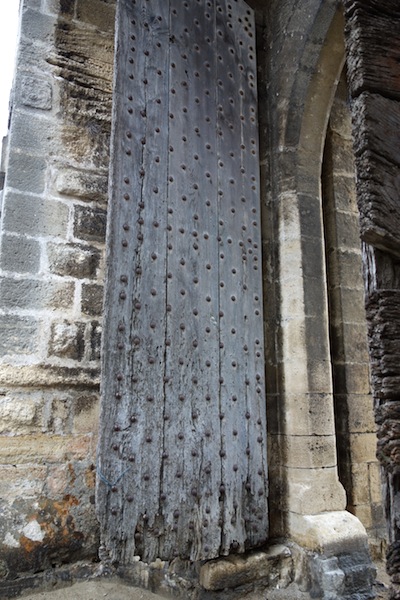 The present gate house door, looking a little worse for wear. I think this door, although old, is more for visual effect. The original would have been much thicker.