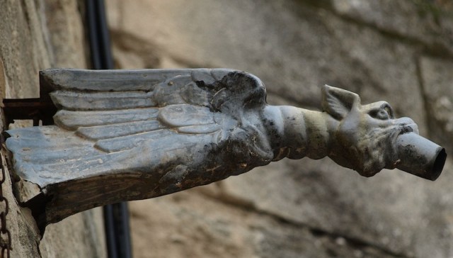 Bronze gargoyle. The object in the gargoyle’s mouth is not a plug but a spout.