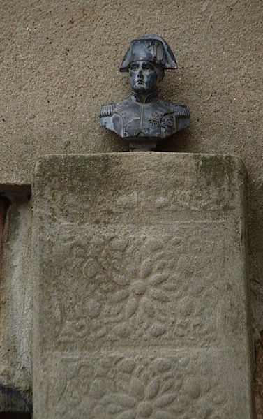 Napoleon, on a pedestal above a window. The bronze was about 100mm high. 