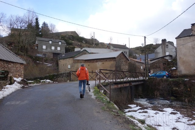 The village of Mirandol. Every village has a guardian dog. Above the blue car the village guardian was sitting on a wall. 
