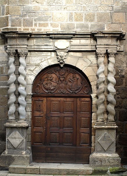 Left- and right-handed stone helical columns adorning a bas-relief door. Helical columns are also referred to as Solomonic or Barley-sugar columns. 