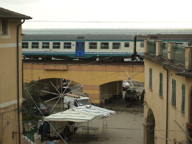 Daytime shot of village square with train, taken from our window. 