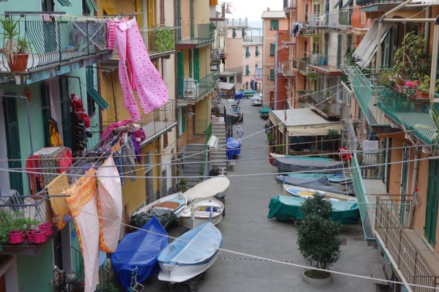 Apartments in all the towns of the Cinque Terre are brightly painted and, as is the case here, bright washing adds even more colour. 