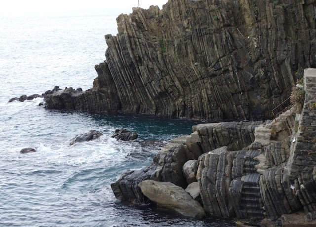 Remarkable geology. Note the steps to the water hewn from parent rock. 