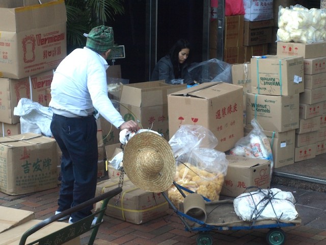 An oldie gathering recyclables to take out. 