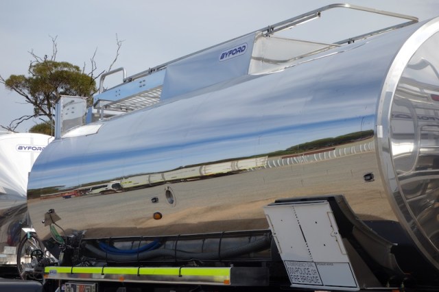 The reflection in this immaculate truck shows an even longer configuration parked opposite. 