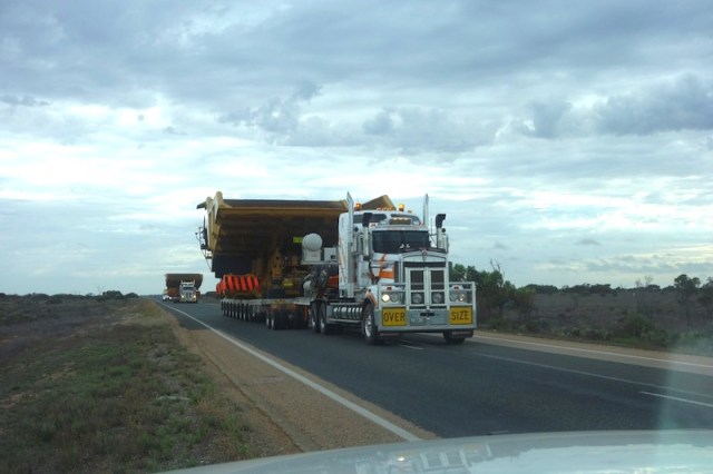 Crossing the Nullarbor means not only contending with long trucks but wide ones as well; two, in this case. 
