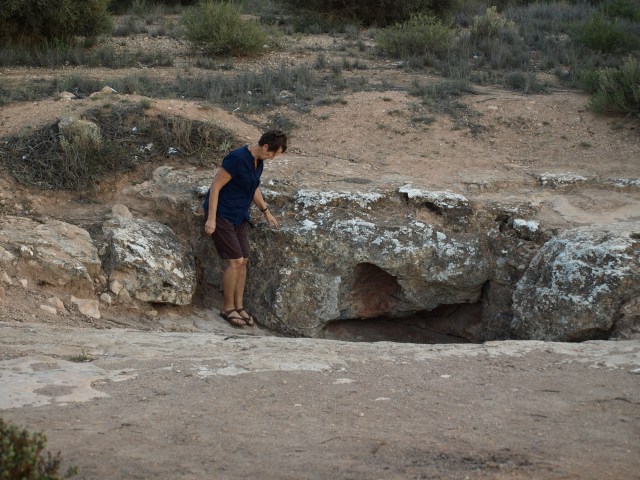 Bev looking down a blowhole. 