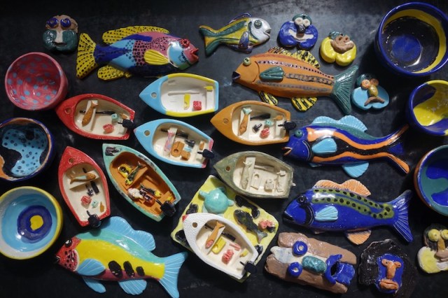 Finished work…fish, bowls, boats and masks. These pieces were fired in an electric kiln on Thursday Island.