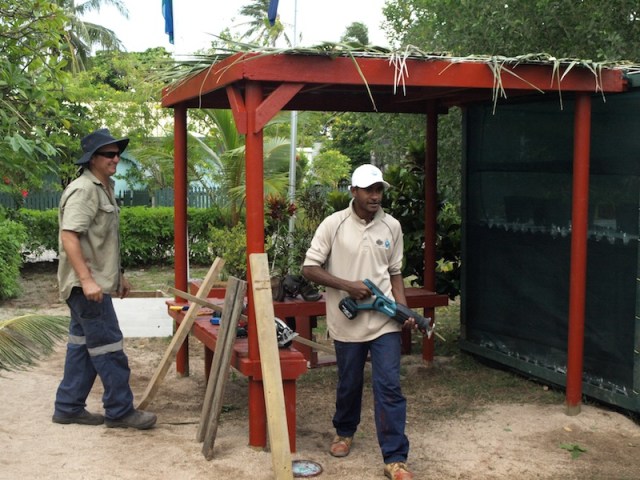 Tim and one of his students putting the finishing touches to the school garden shop. 