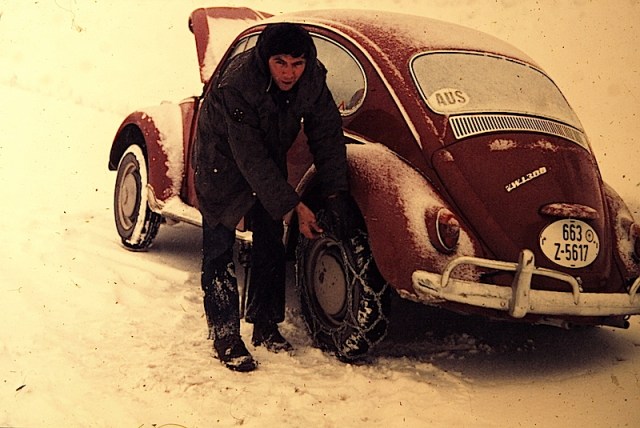 Getting the chains on. The easiest way to put chains on is to jack the car up then slip the chains under the wheel. 