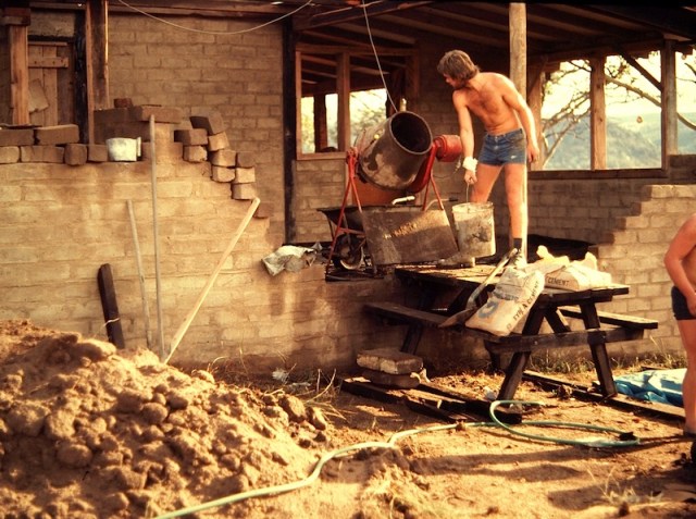 Building our mudbrick house. Our English friend Bill making mortar and laying up the bricks. Bill now lives in the US and writes comments on this blog. 