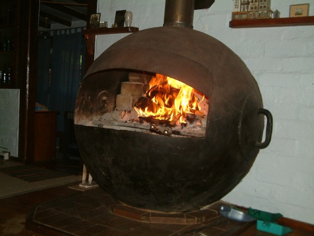 Our fireplace, a modified buoy. I came across 300 of these in a scrapyard in Sydney. They were used to suspend an anti-submarine net across the entrance of Sydney harbour during WW2.