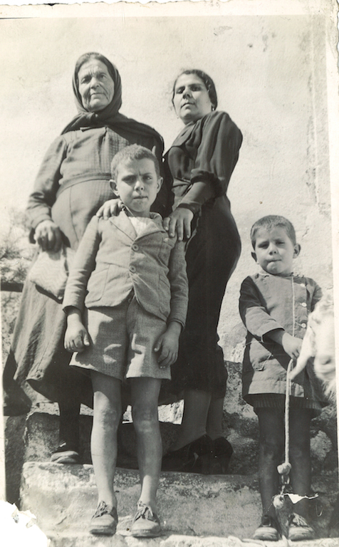 From left to right. Yiayia Stavroula (Aleko’s grandmother). Metaxia, Aleko and Tzaneto. I do like the low camera angle. 