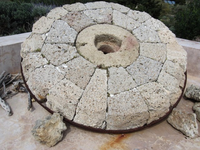 Mill stone--approximately one and a half metres in diameter.
