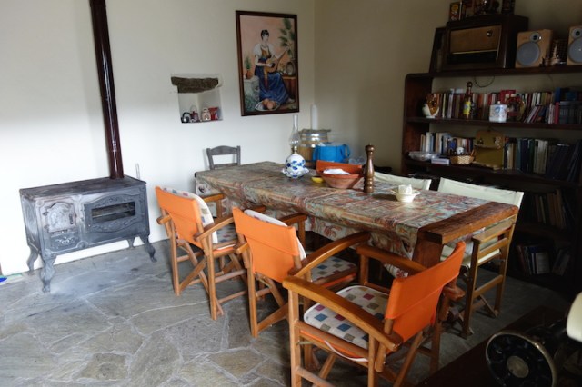 Dining area. We very much enjoyed using the wood stove. 