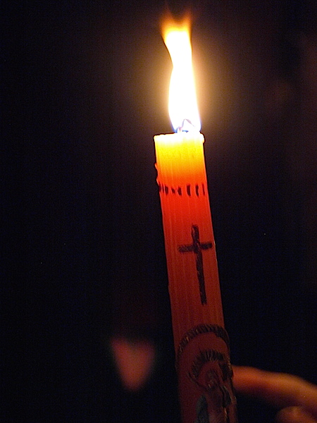 Burning one of the precious candles. 
