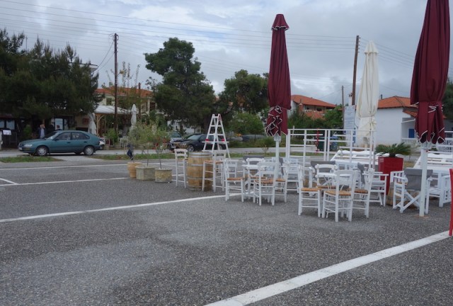 Restaurants set up tables and chairs outside for the summer. 