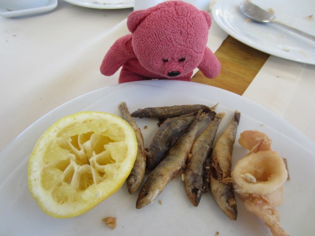 Sardines, octopus, lemon and bread. 