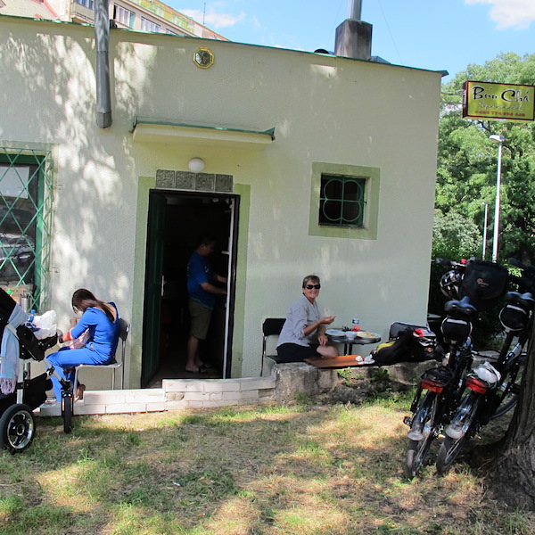 Eating with the owner’s family at the kitchen door. 
