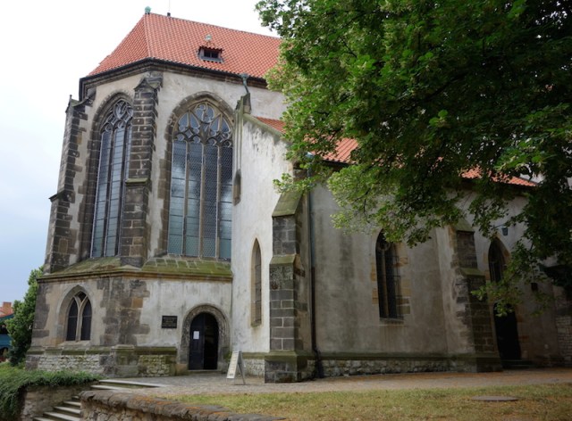 The charnel-house was in through the black door, the one with the notice on it. 