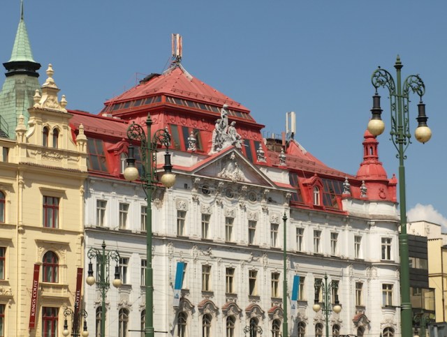 A difficult one to describe with such a mixture of architectural styles and colours. The most prominent thing I see is the mobile phone aerials. I think we could say it is an anachronism. 