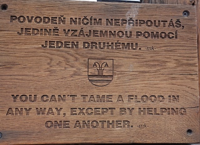 A pertinent sign on the flood marker.