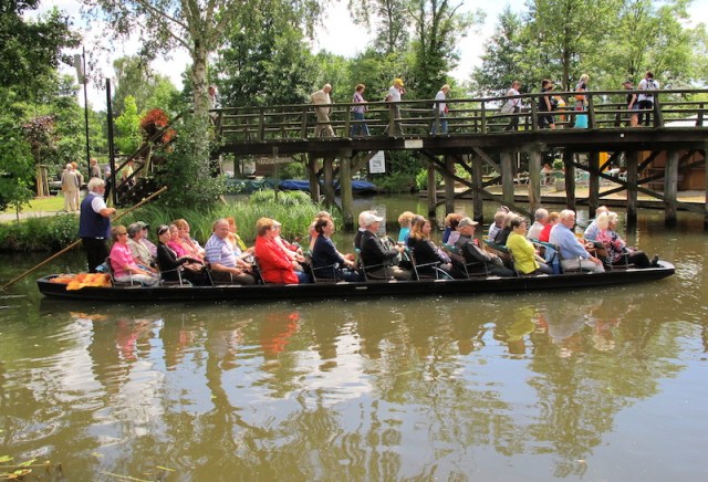 Tourists passing under a raised bridge. Sometimes we ask ourselves, ‘Are we tourists?’. The answer is no, because we don’t do this! We are travellers! 