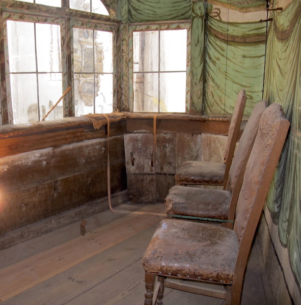 Inside one of the private boxes. Can you imaging the gentry and their ladies sitting on these chairs? 