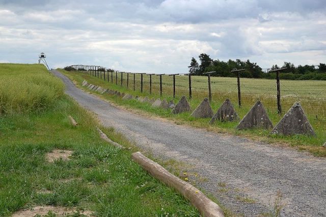 Preserved part of the Iron Curtain in the Czech Republic. The concrete pyramids are tank traps. Image by Marchin Szala via Wikipedia. To see more of Machen’s work search Pudelek. 