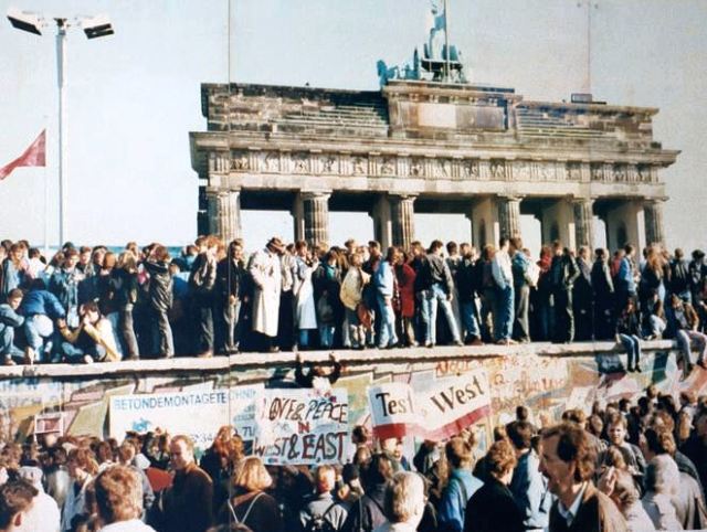 The Berlin wall in front of the Brandenburg Gate in 1989 just prior to its fall. Photographer unknown. 
