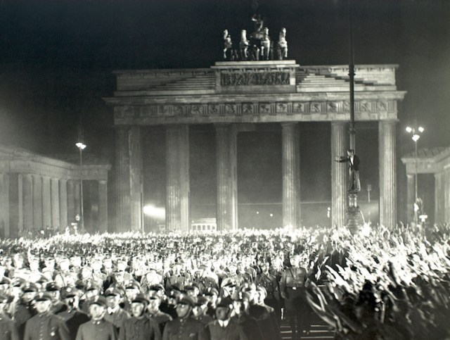 Brandenburg Gate during WW2. The Nazi masses passing through the gate. 