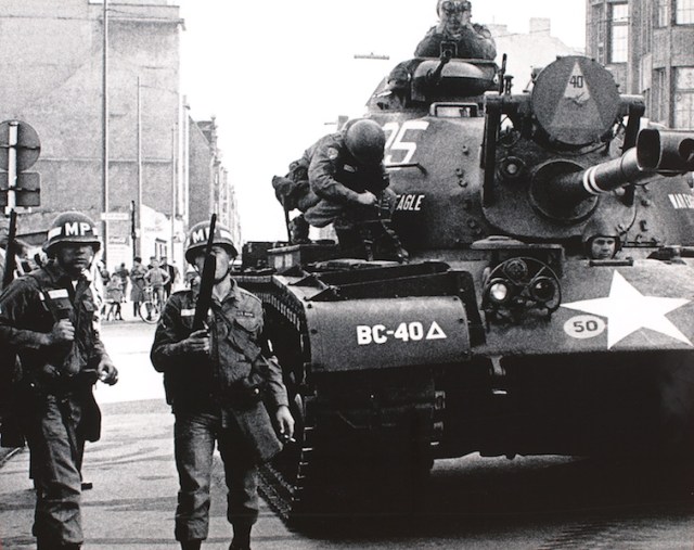 American tank at the Checkpoint Charlie standoff. Photo of a wall poster near Checkpoint Charlie. Photographer unknown. 