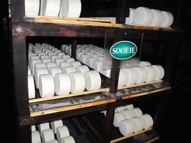 Wheels of cheese maturing in the Combalou caves at Roquefort. The cheese wheels sit here for 15 to 25 days