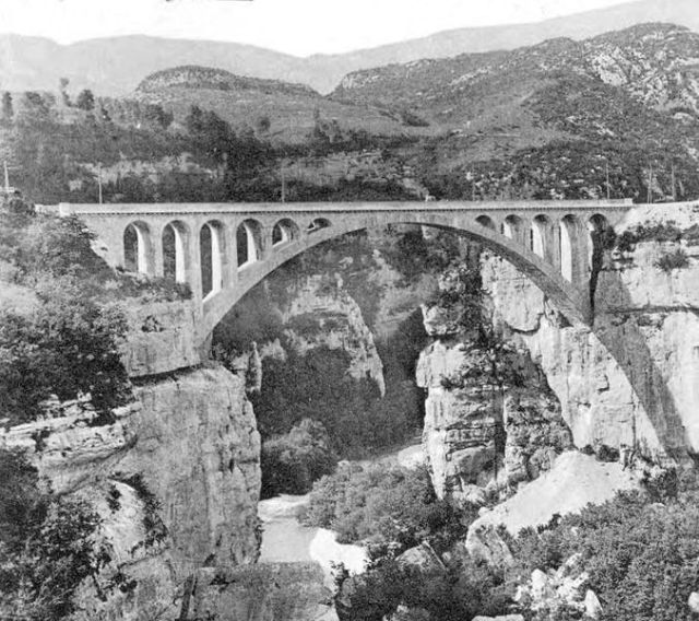 Massive segmental arch of the Pont du Moulin des Pierres bridge near Montanges over the Valserine River in the Haute-Jura France. Image: Copyright free. 