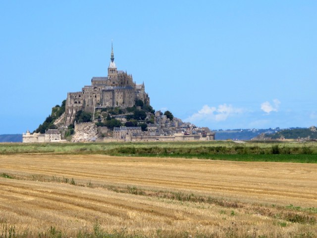 Mont St Michel surrounded by wheatfields, sea and history. 