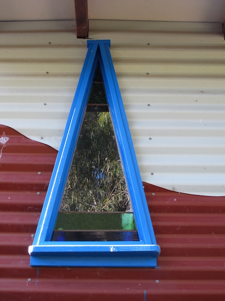 Triangular window in the shower recess at our home. 