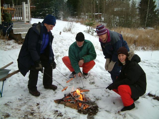 Cooking a snag (sausage) outside the summerhouse 2006. 