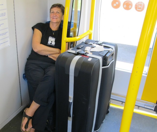 Bev with her bike case on the train in Sydney. 