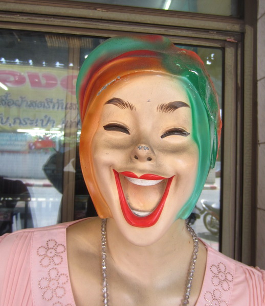 A Thai mannequin demonstrating a Thai smile. 