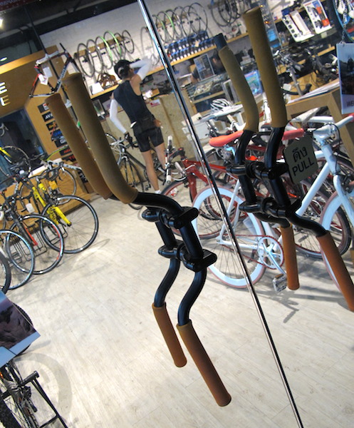 Creative door handles (bike handlebars) on one of the bike shops in Bangkok. 