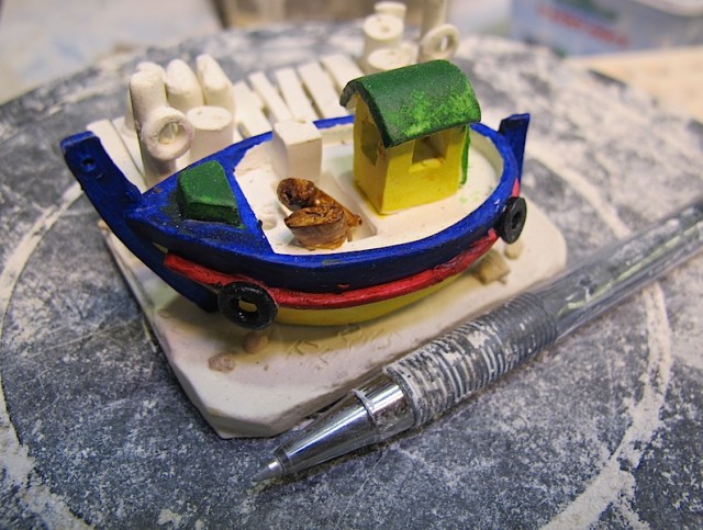 A recent ceramic reproduction of a Greek fishing boat.
