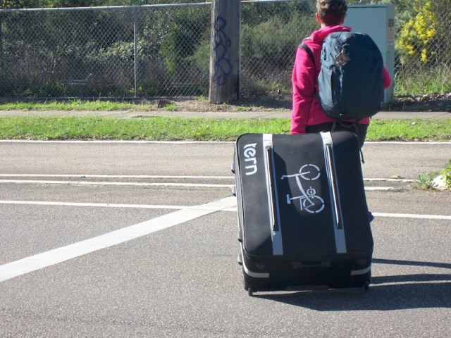 Bev pulling the bike case to Mt Kuring-gai station. 